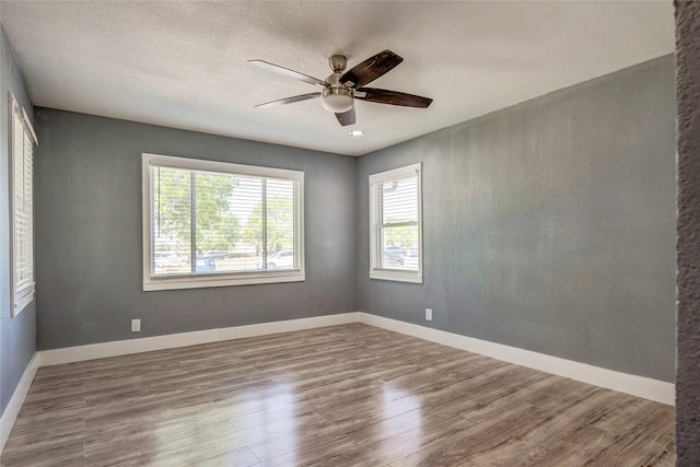 110 Pine St, Weatherford, TX 76086 - empty room featuring wood finished floors, ceiling fan, and baseboards