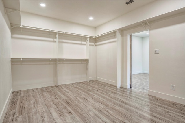 110 Pine St, Weatherford, TX 76086 - walk in closet with visible vents and wood finished floors