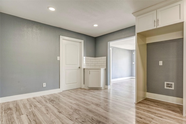 110 Pine St, Weatherford, TX 76086 - empty room with light wood-type flooring, baseboards, and recessed lighting