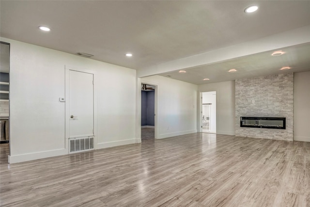 110 Pine St, Weatherford, TX 76086 - unfurnished living room featuring recessed lighting, visible vents, and light wood-type flooring