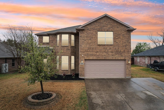 208 Wenrick Dr, Roanoke, TX 76262 - view of front facade featuring a garage, ac unit, concrete driveway, a yard, and brick siding
