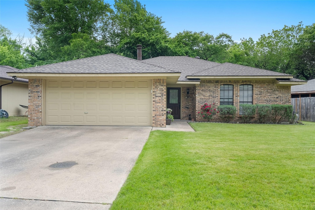 1510 Limetree Ln, Duncanville, TX 75137 - single story home with fence, a front lawn, concrete driveway, brick siding, and a garage
