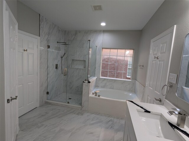 bathroom featuring vanity, a marble finish shower, visible vents, marble finish floor, and a garden tub