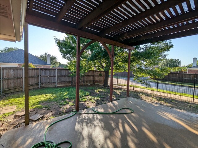 view of patio featuring a pergola and a fenced backyard
