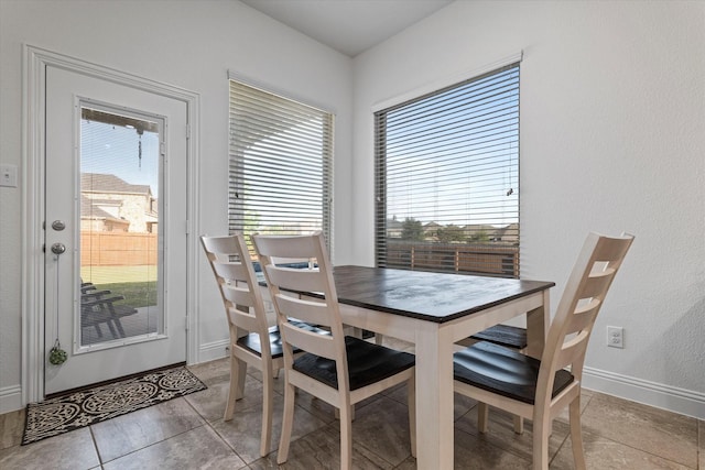 525 Northwood Dr, Oak Point, TX 75068 - dining space with baseboards and light tile patterned floors