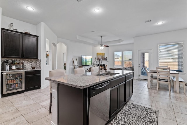 525 Northwood Dr, Oak Point, TX 75068 - kitchen featuring stainless steel dishwasher, beverage cooler, a sink, tasteful backsplash, and open floor plan