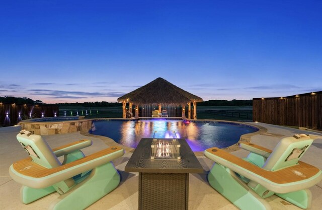 8370 Old Springtown Rd, Springtown, TX 76082 - view of pool featuring a gazebo, a pool with connected hot tub, an outdoor fire pit, a fenced backyard, and a patio area