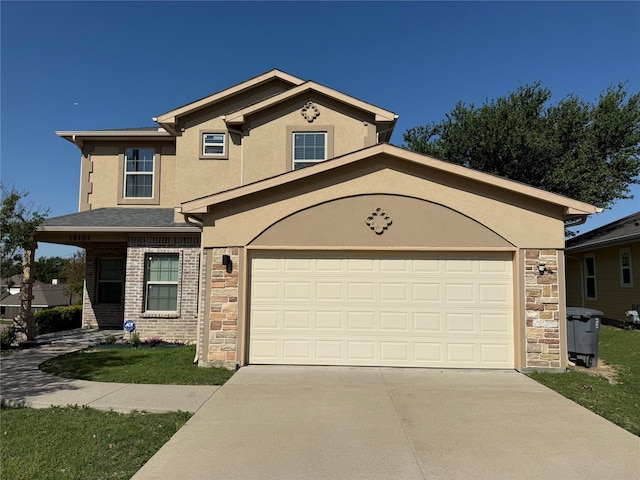 18101 Justice Ln, Dallas, TX 75287 - view of front of house with stone siding, driveway, and stucco siding