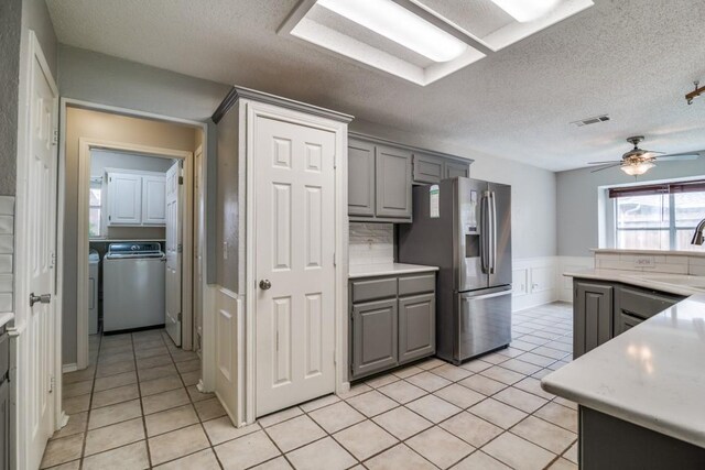 511 Windsor Way, Rockwall, TX 75087 - kitchen with stainless steel refrigerator with ice dispenser, gray cabinets, a sink, light tile patterned floors, and wainscoting