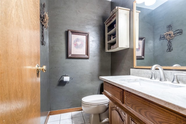 bathroom with tile patterned flooring, vanity, and toilet