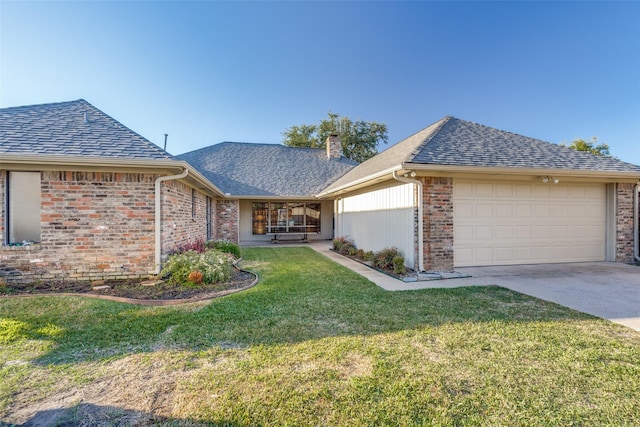 ranch-style home featuring roof with shingles, driveway, a front lawn, an attached garage, and brick siding