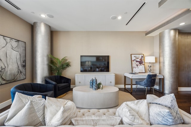2408 Victory Park Ln Unit 1031, Dallas, TX 75219 - living area with decorative columns, baseboards, and visible vents