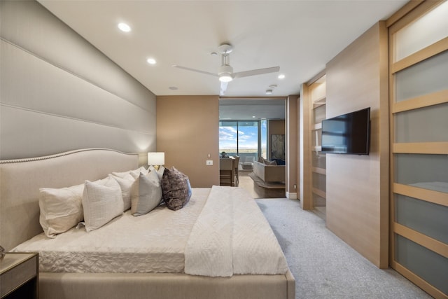 2408 Victory Park Ln Unit 1031, Dallas, TX 75219 - bedroom with light carpet, a ceiling fan, and recessed lighting