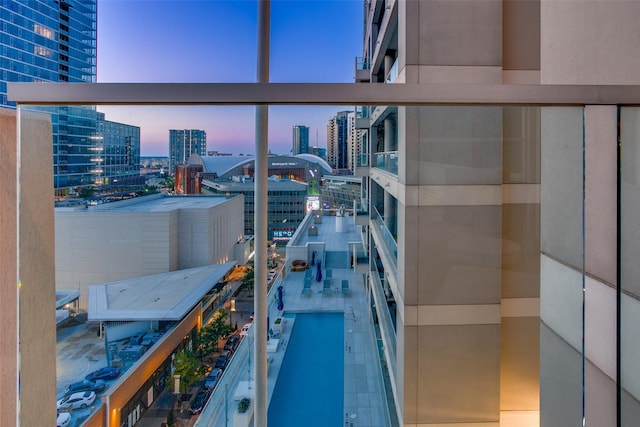 2408 Victory Park Ln Unit 1031, Dallas, TX 75219 - balcony at dusk with a city view