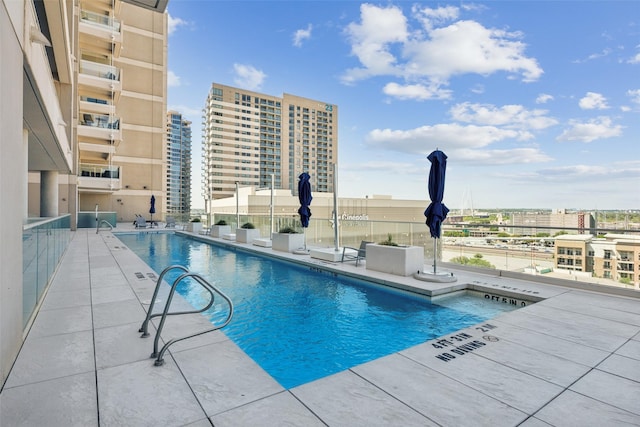 2408 Victory Park Ln Unit 1031, Dallas, TX 75219 - pool with a view of city and a patio