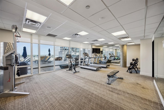 2408 Victory Park Ln Unit 1031, Dallas, TX 75219 - workout area featuring carpet, visible vents, and a paneled ceiling