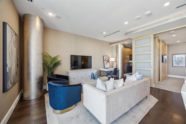 2408 Victory Park Ln Unit 1031, Dallas, TX 75219 - living room featuring decorative columns, visible vents, recessed lighting, wood finished floors, and baseboards