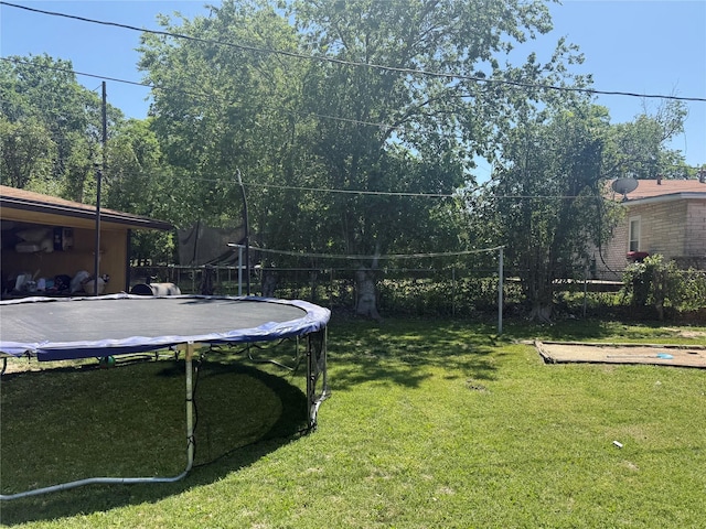 view of yard with a trampoline