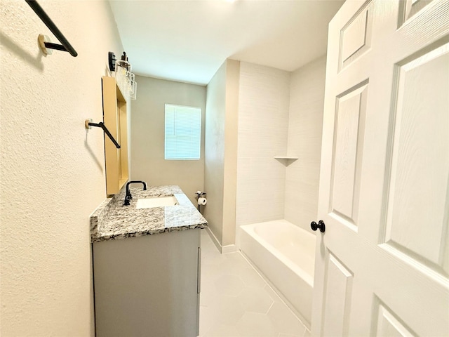 1901 SE 12th St, Mineral Wells, TX 76067 - bathroom with double vanity, tile patterned floors, and a textured wall