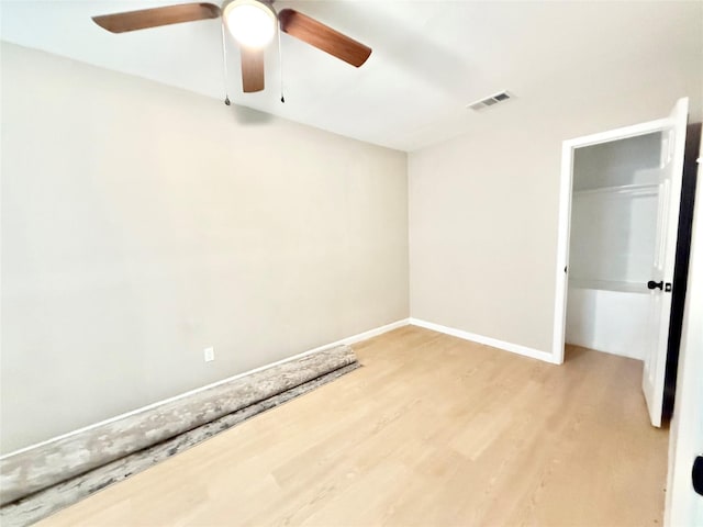 1901 SE 12th St, Mineral Wells, TX 76067 - unfurnished bedroom with light wood-style floors, baseboards, and a ceiling fan