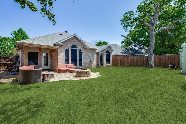 6828 Crenshaw Ln, Denton, TX 76210 - rear view of house with a shingled roof, brick siding, a patio, and an outdoor living space with a fire pit