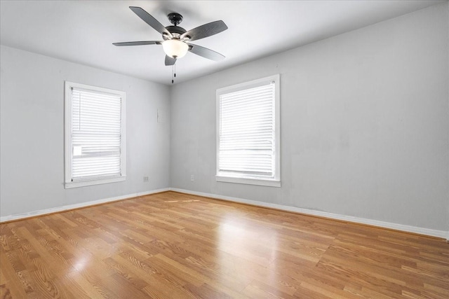 spare room with light wood-style floors and a wealth of natural light