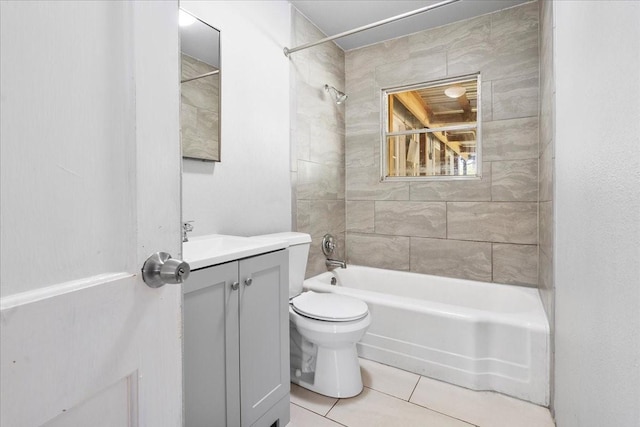 full bath featuring toilet, tile patterned floors, vanity, and bathtub / shower combination