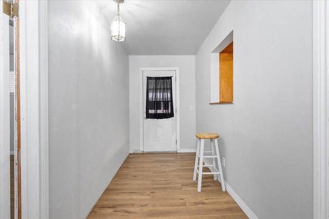 hallway featuring light wood-style floors