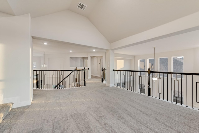 6926 Prairieside Trl, Prairie Ridge, TX 76084 - hallway featuring an upstairs landing, carpet flooring, baseboards, high vaulted ceiling, and recessed lighting