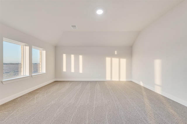 6926 Prairieside Trl, Prairie Ridge, TX 76084 - spare room featuring lofted ceiling, carpet flooring, and baseboards