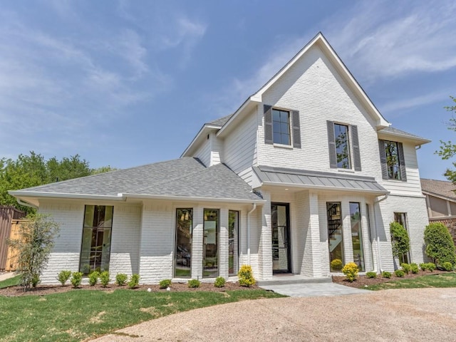 6909 Middle Cove Dr, Dallas, TX 75248 - view of front of property featuring roof with shingles and brick siding
