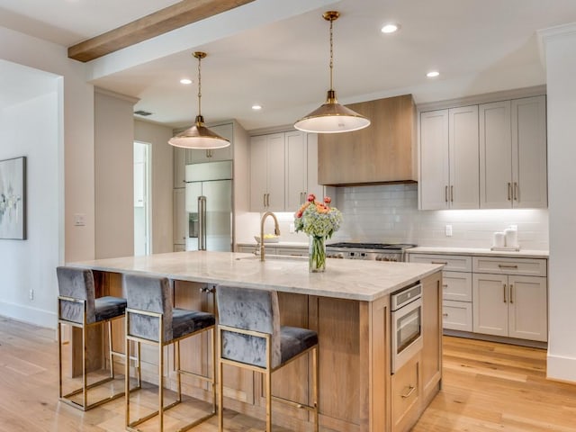 6909 Middle Cove Dr, Dallas, TX 75248 - kitchen featuring custom exhaust hood, tasteful backsplash, built in appliances, light wood-style floors, and a spacious island