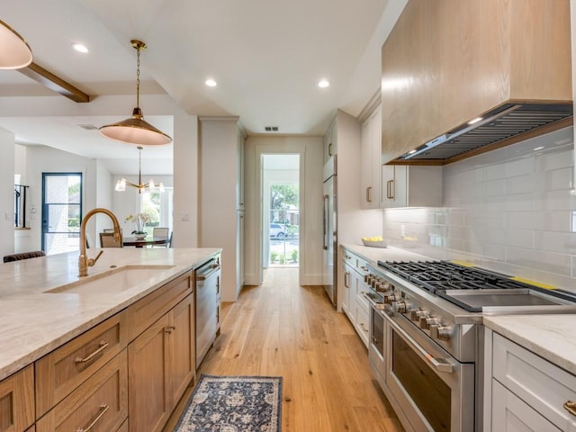 6909 Middle Cove Dr, Dallas, TX 75248 - kitchen with light wood-type flooring, custom range hood, a sink, high quality appliances, and decorative backsplash