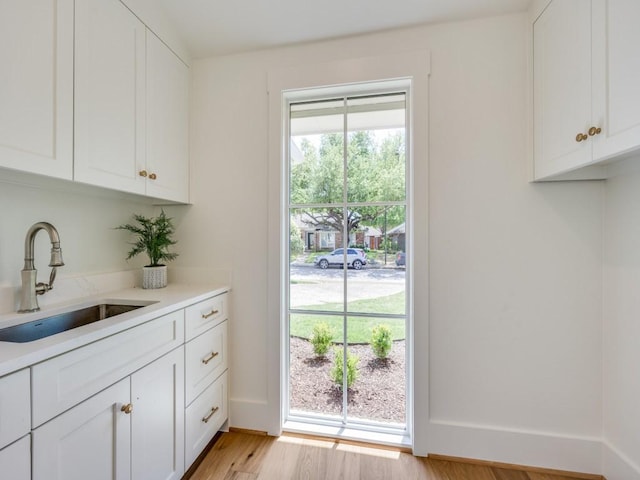 6909 Middle Cove Dr, Dallas, TX 75248 - interior space featuring light wood-type flooring and a sink