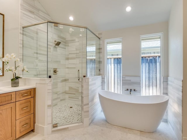 6909 Middle Cove Dr, Dallas, TX 75248 - full bath featuring a freestanding bath, a shower stall, recessed lighting, vanity, and tile patterned floors