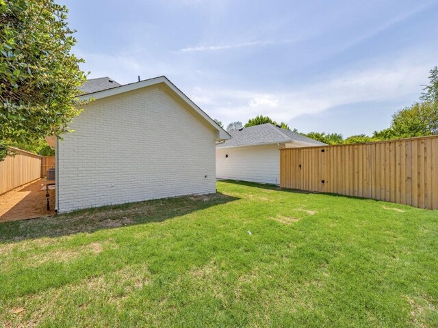 6909 Middle Cove Dr, Dallas, TX 75248 - view of yard with a fenced backyard
