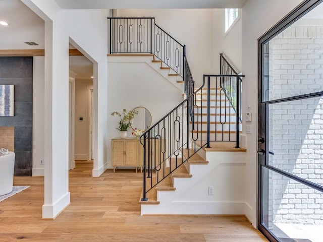 6909 Middle Cove Dr, Dallas, TX 75248 - entryway featuring visible vents, baseboards, and wood finished floors