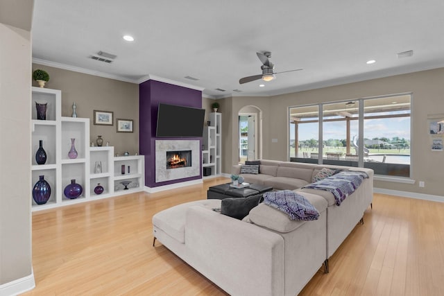 living room with recessed lighting, wood finished floors, visible vents, a ceiling fan, and a fireplace