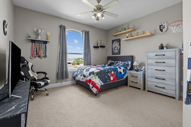 bedroom with light carpet, a ceiling fan, and baseboards