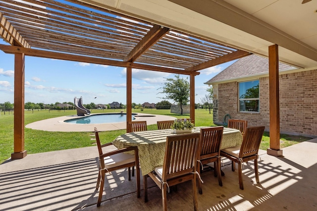 view of patio / terrace featuring a pergola, outdoor dining space, and an outdoor pool