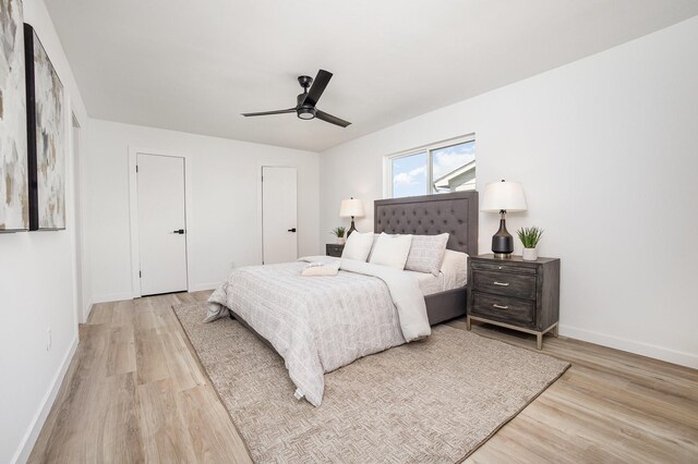5629 Terry St, The Colony, TX 75056 - bedroom featuring light wood finished floors, baseboards, connected bathroom, and a ceiling fan