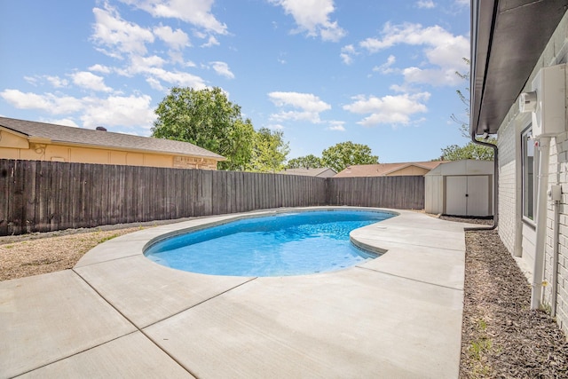 5629 Terry St, The Colony, TX 75056 - view of swimming pool with a fenced backyard, an outbuilding, and a storage shed