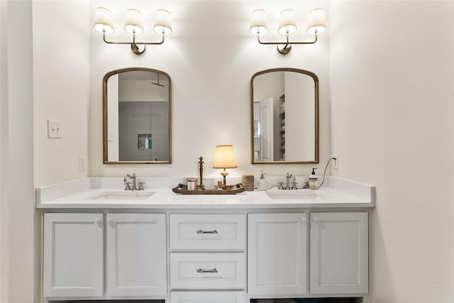 full bathroom featuring a sink and double vanity