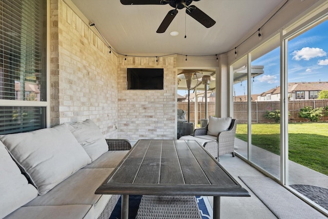 1057 Canterbury Ln, Forney, TX 75126 - sunroom featuring a ceiling fan and an outdoor living space