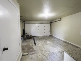 garage featuring baseboards