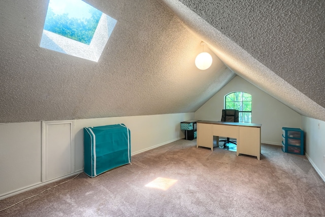 additional living space featuring carpet floors, vaulted ceiling, and a textured ceiling