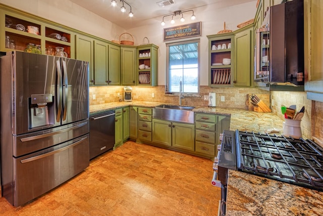 kitchen featuring stainless steel fridge, open shelves, and green cabinetry