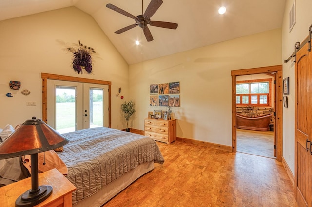 bedroom featuring french doors, a barn door, visible vents, access to exterior, and high vaulted ceiling