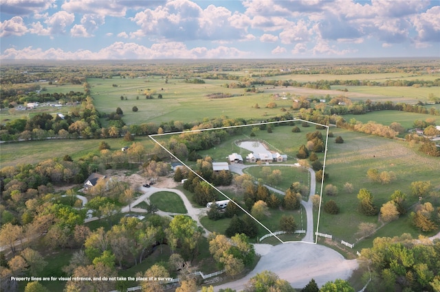 birds eye view of property featuring a rural view