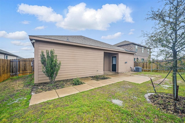202 Lake Rdg, Princeton, TX 75407 - rear view of house with a yard, a fenced backyard, cooling unit, and a patio